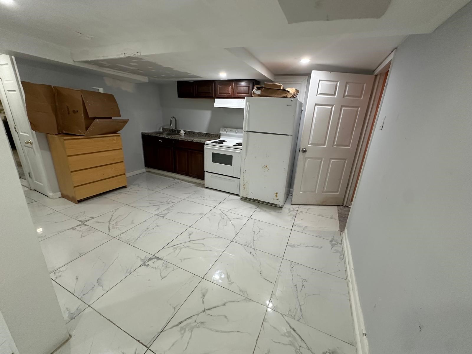 Lower Level One Bedroom, Living, Kitchen & Bath Including Utilities.